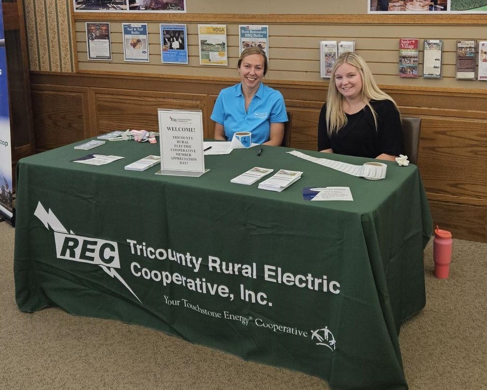 Tricounty employees helping members check in